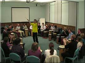 A fun drumming workshop in an ideal conference room.